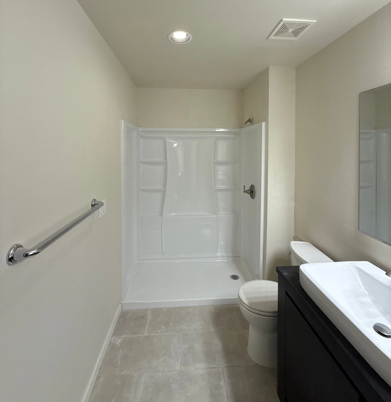 Newly installed shower, sink and toilet