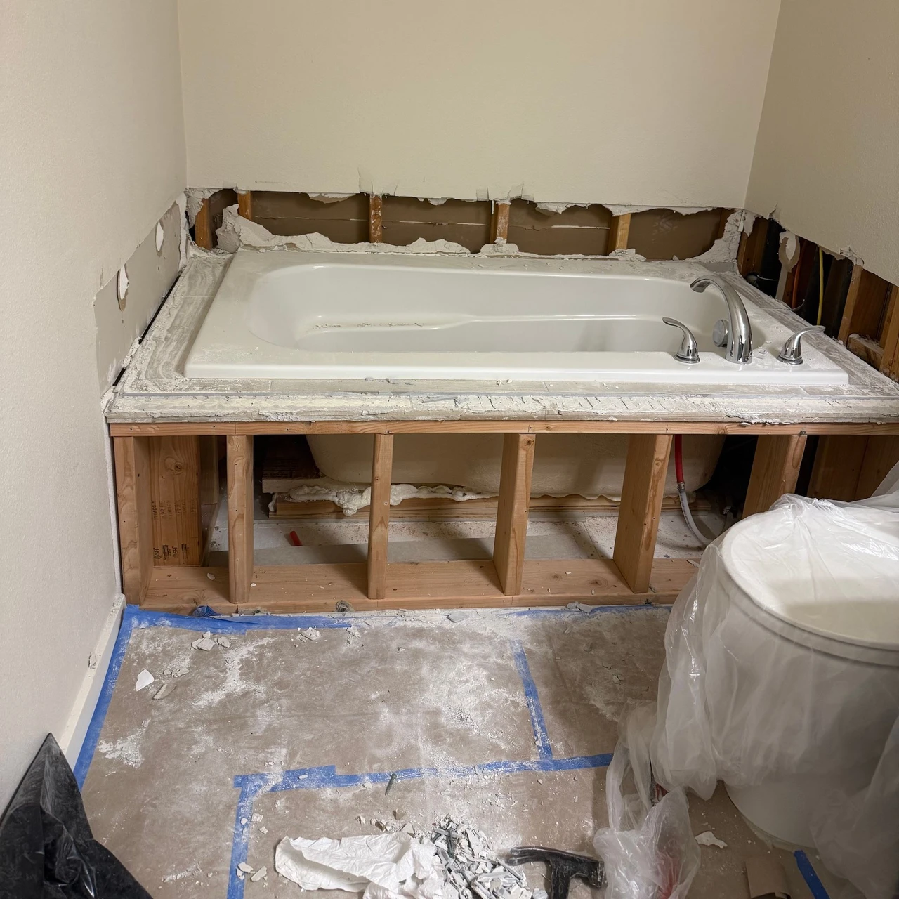 Bathtub with the sides removed to get it ready for demolition