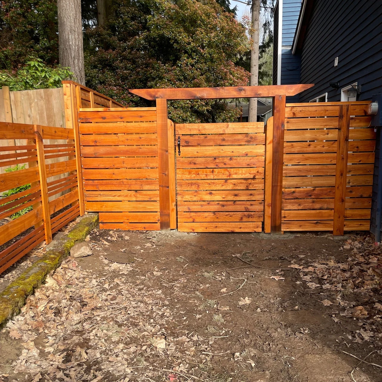 Decorative entryway of a bright colored fence