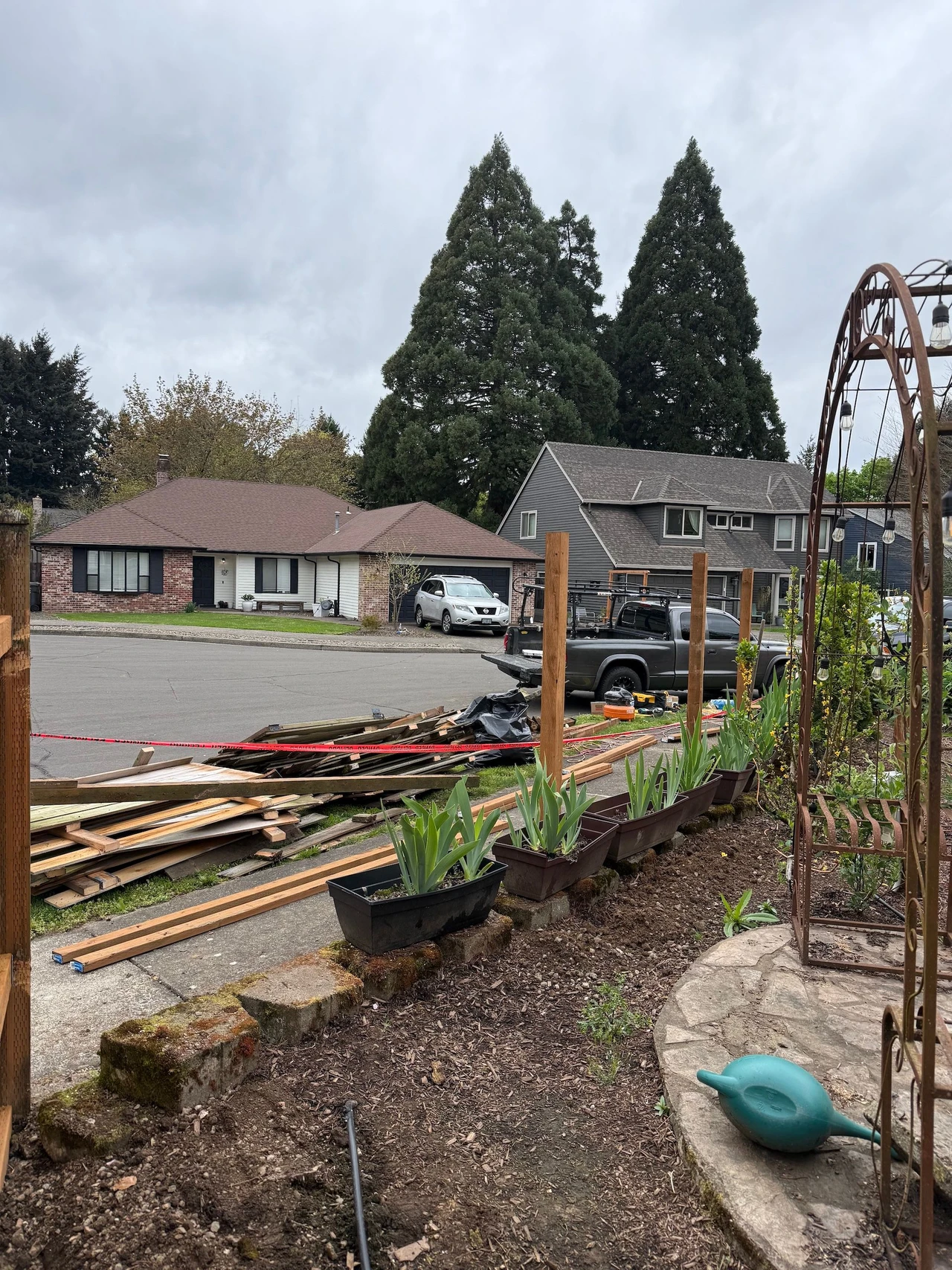 A garden with fence posts installed
