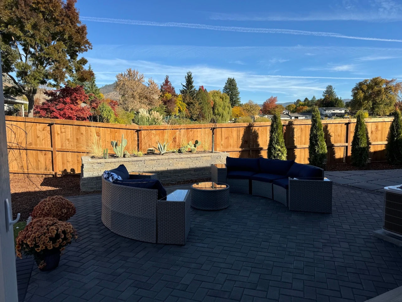 A paver patio with 2 patio couches facing each other