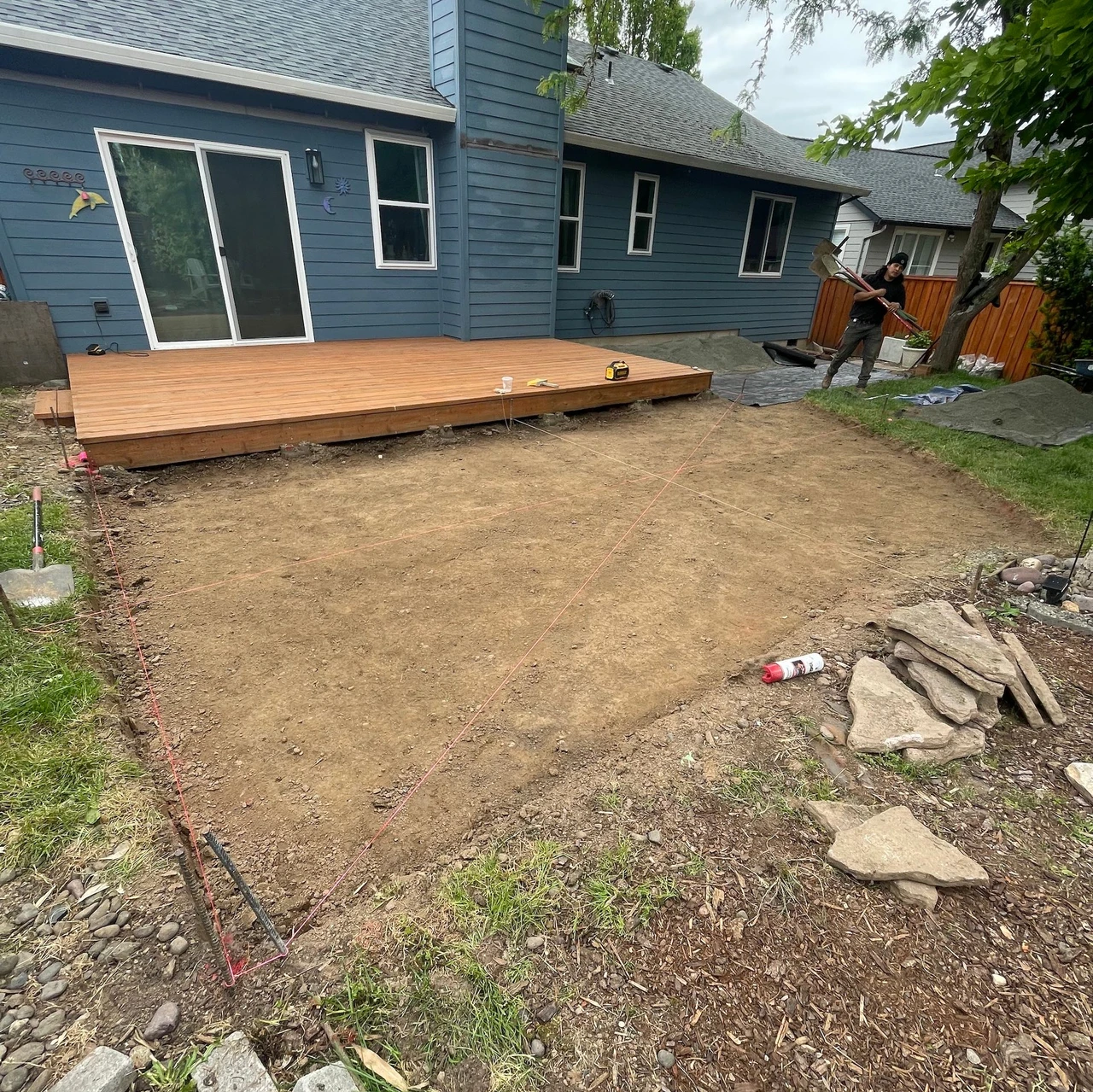 Completed wood deck with lawn torn out for a future hardscape installation