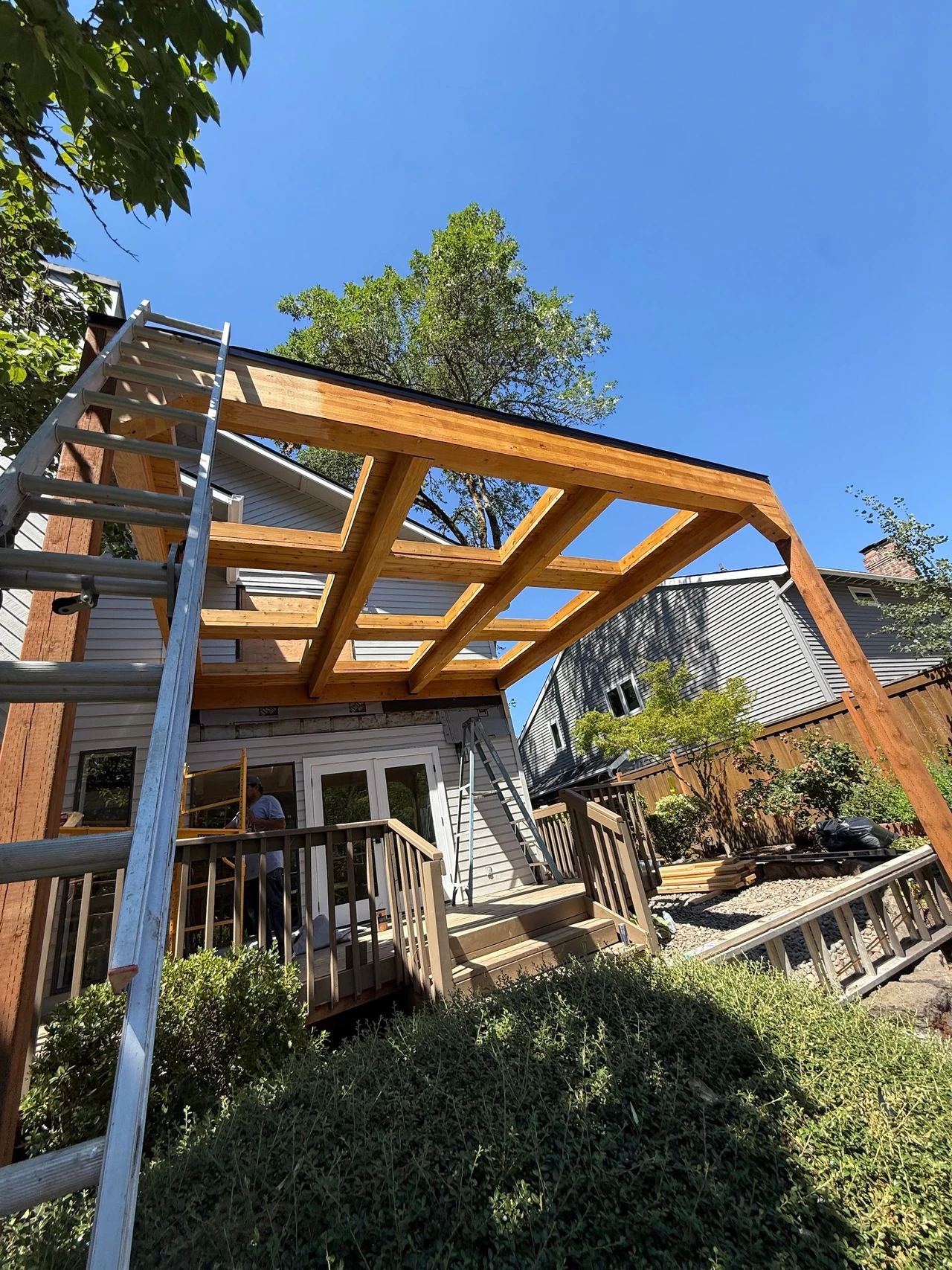 pergola with a porch underneath